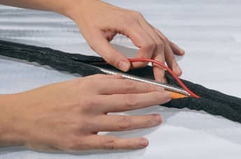 Easy to use desk cable management idea: the self-closing Twist-In.